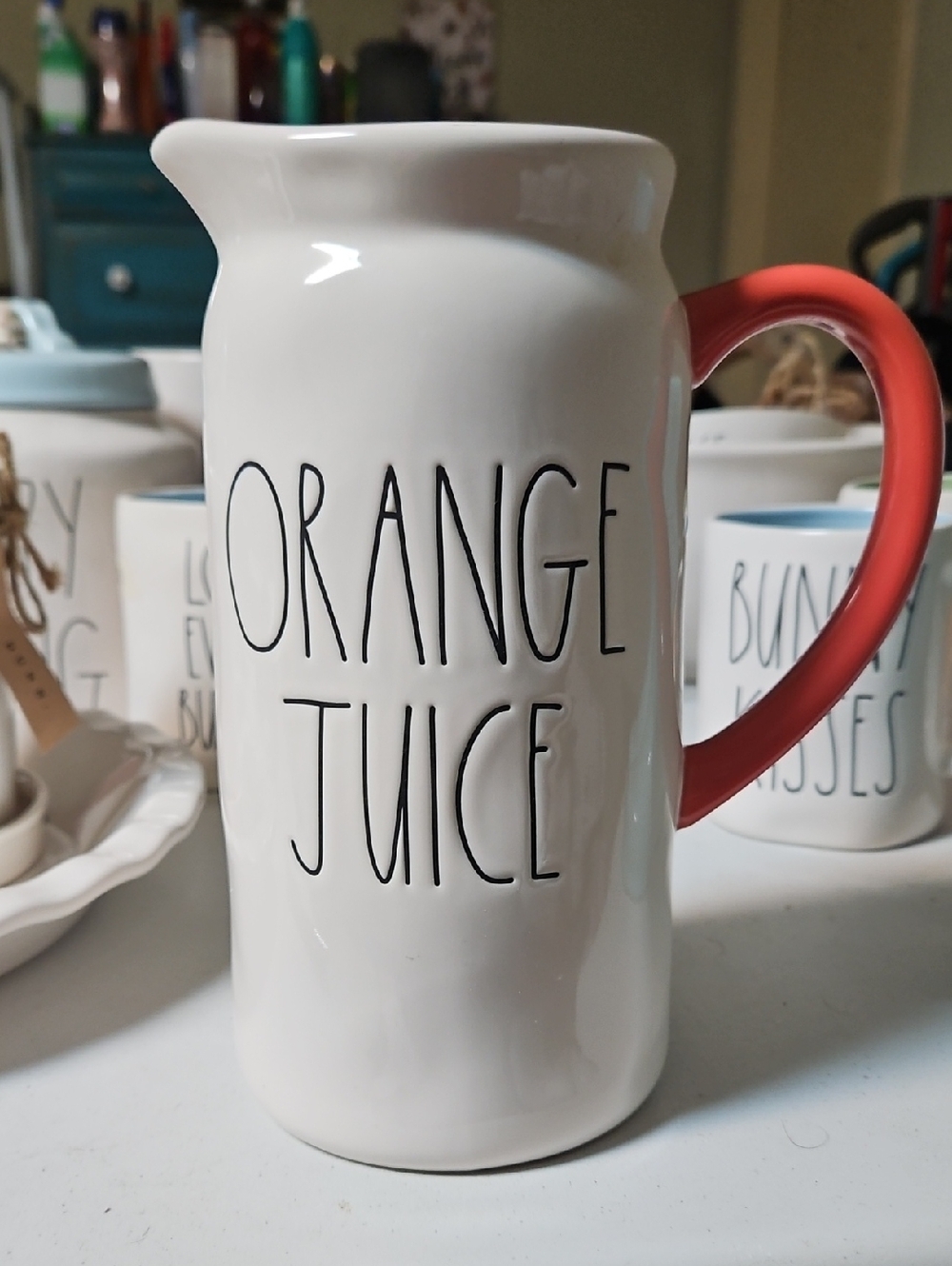 Rae Dunn , white Ceramic 'Orange Juice' Pitcher with Orange Handle